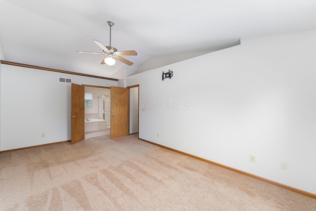 5516 Latrobe St, Westerville, OH 43081 - unfurnished bedroom with light carpet, baseboards, and lofted ceiling