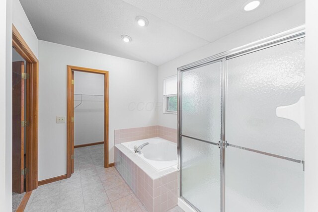 5516 Latrobe St, Westerville, OH 43081 - full bath with a stall shower, a bath, a walk in closet, tile patterned flooring, and baseboards