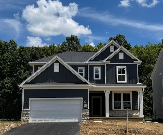 3441 Tender Ave Lot 7157, Powell, OH 43065 - craftsman-style house with a porch, stone siding, asphalt driveway, and board and batten siding