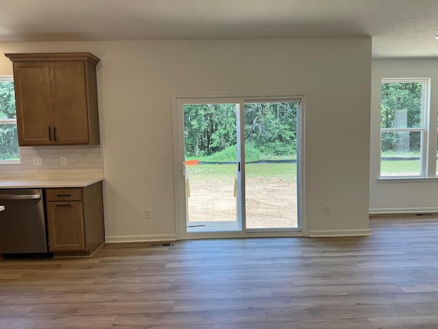 3441 Tender Ave Lot 7157, Powell, OH 43065 - kitchen with dishwasher, light wood-type flooring, tasteful backsplash, and light countertops