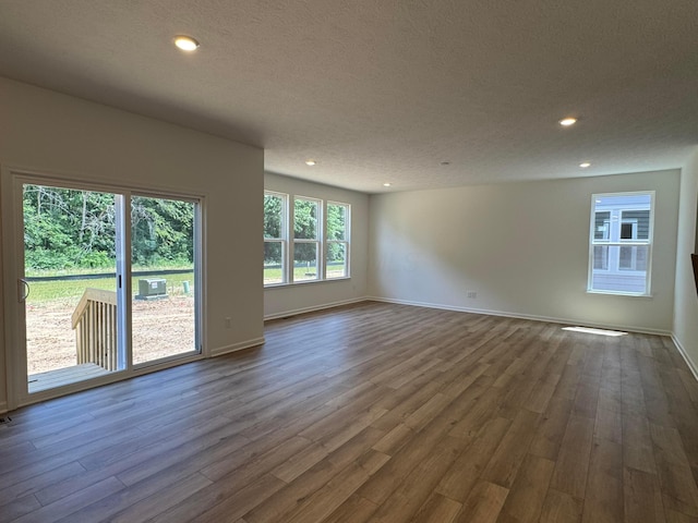 3441 Tender Ave Lot 7157, Powell, OH 43065 - unfurnished room with dark wood-style floors, recessed lighting, and a textured ceiling
