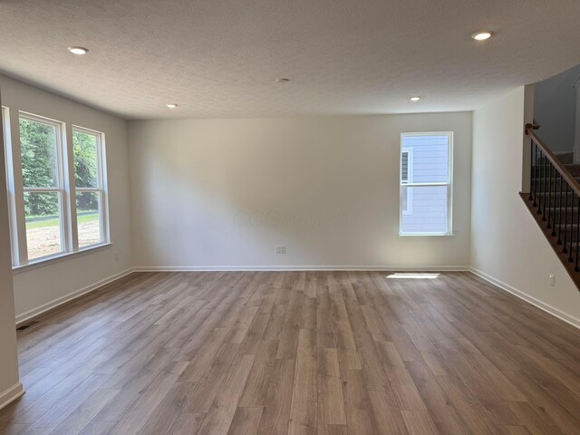 3441 Tender Ave Lot 7157, Powell, OH 43065 - spare room featuring stairway, wood finished floors, recessed lighting, and a textured ceiling