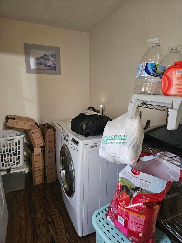 laundry room with washer and dryer, laundry area, and dark wood-style floors