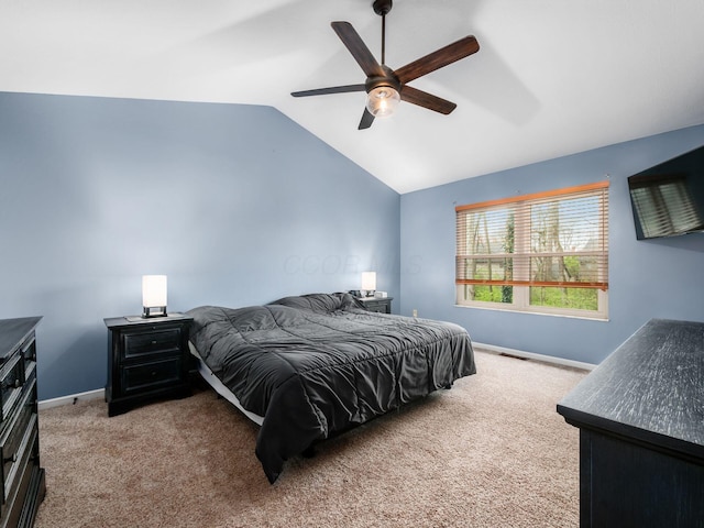 carpeted bedroom featuring visible vents, baseboards, a ceiling fan, and lofted ceiling