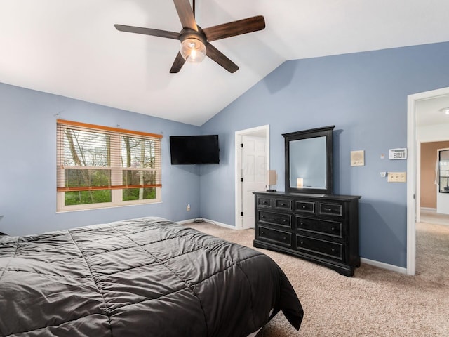bedroom featuring baseboards, carpet flooring, and vaulted ceiling