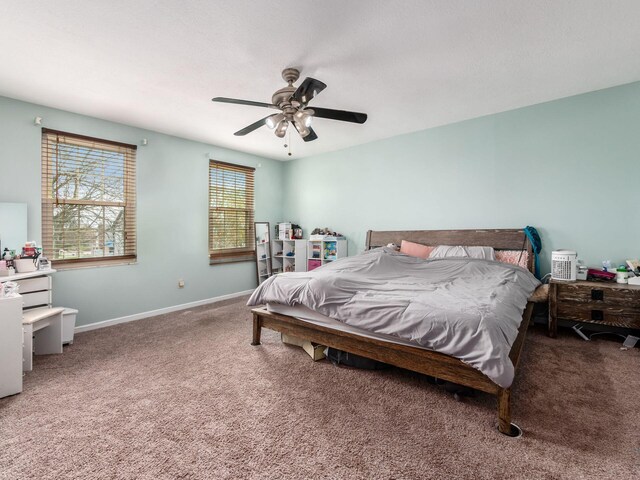 bedroom featuring carpet, baseboards, and a ceiling fan