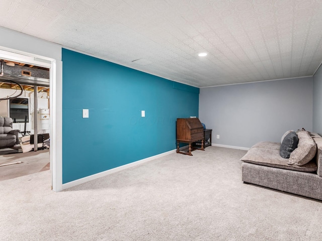 sitting room with recessed lighting, carpet, and baseboards