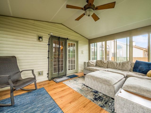 sunroom featuring outdoor lounge area, a wealth of natural light, and a ceiling fan