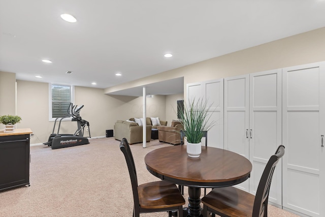 dining space with light colored carpet, baseboards, and recessed lighting