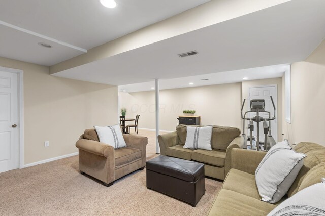 carpeted living area featuring recessed lighting, visible vents, and baseboards