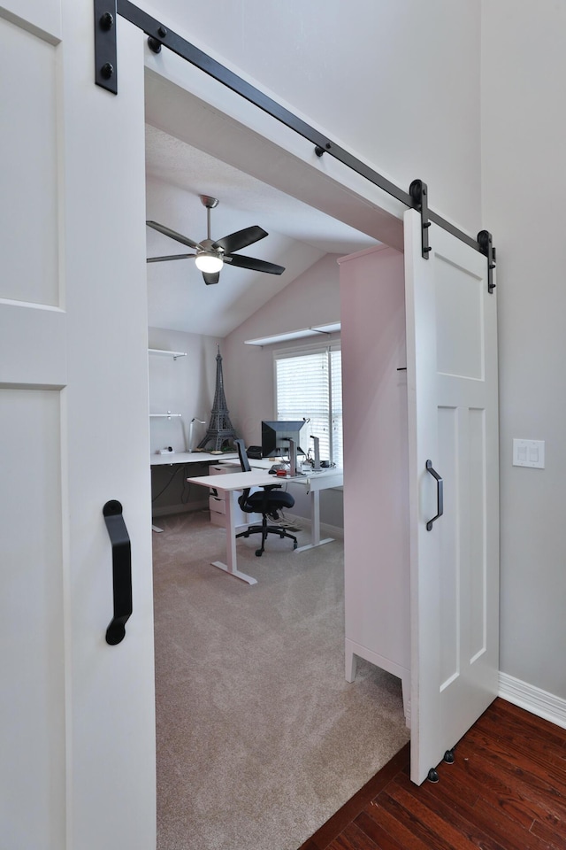 6185 Pollard Place Dr, Hilliard, OH 43026 - office area with baseboards, a ceiling fan, a barn door, lofted ceiling, and carpet