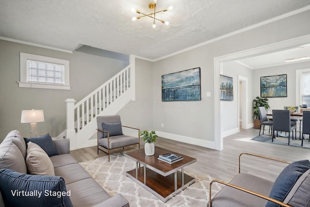 living room with stairway, wood finished floors, a notable chandelier, and a textured ceiling
