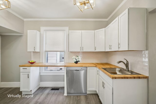 kitchen featuring butcher block countertops, wood finished floors, dishwasher, and a sink