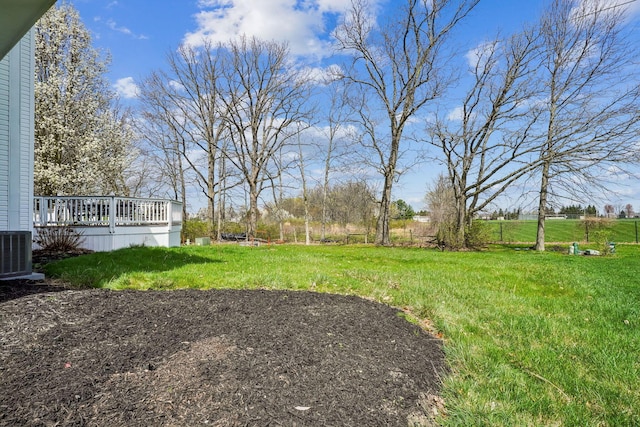 view of yard featuring a deck and cooling unit