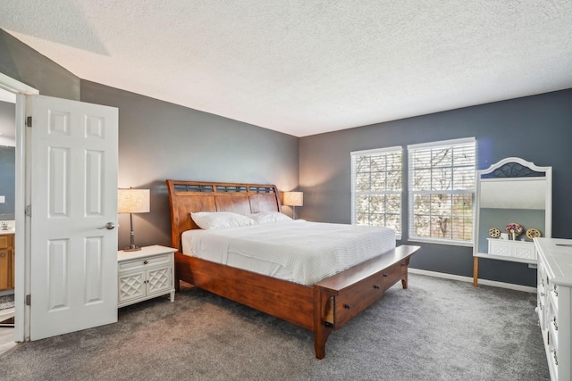 bedroom with baseboards, dark carpet, and a textured ceiling