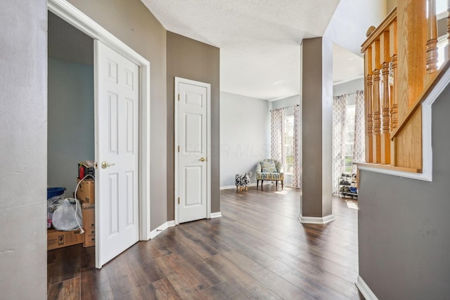 corridor with baseboards and dark wood-style floors