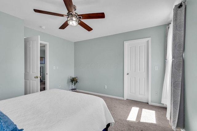 bedroom featuring carpet, baseboards, and ceiling fan