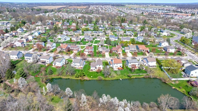 birds eye view of property with a water view and a residential view