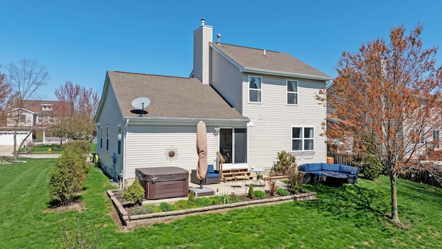rear view of house with roof with shingles, a chimney, a patio area, entry steps, and a yard