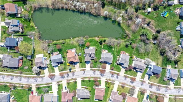 drone / aerial view with a residential view and a water view