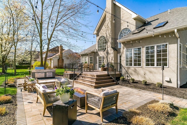 view of patio with an outdoor living space and a wooden deck