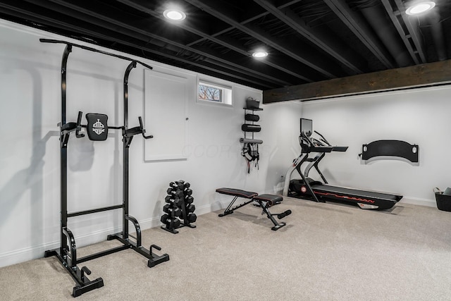 workout area with carpet flooring and baseboards