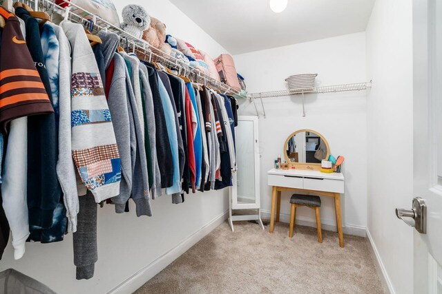 spacious closet with carpet floors