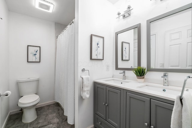 full bath featuring a sink, visible vents, toilet, and double vanity
