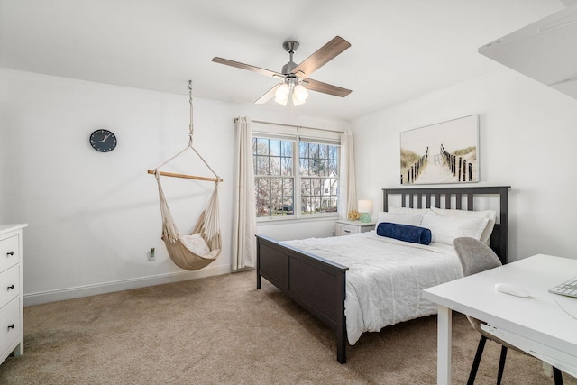 bedroom featuring baseboards, ceiling fan, and light carpet