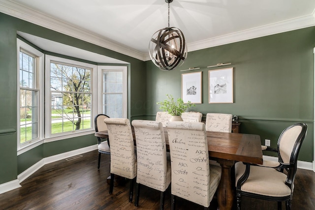 dining room featuring dark wood-style flooring, baseboards, an inviting chandelier, and visible vents