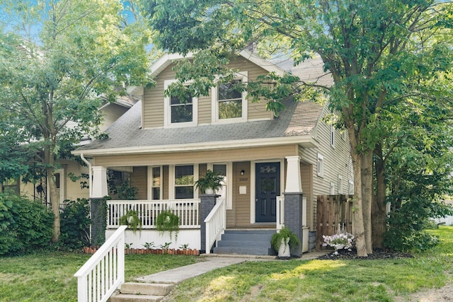 1069 Miller Ave, Columbus, OH 43206 - view of front of house featuring a shingled roof, covered porch, and a front yard