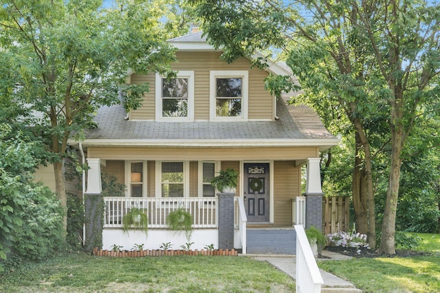 1069 Miller Ave, Columbus, OH 43206 - view of front of home with a porch, roof with shingles, and a front yard
