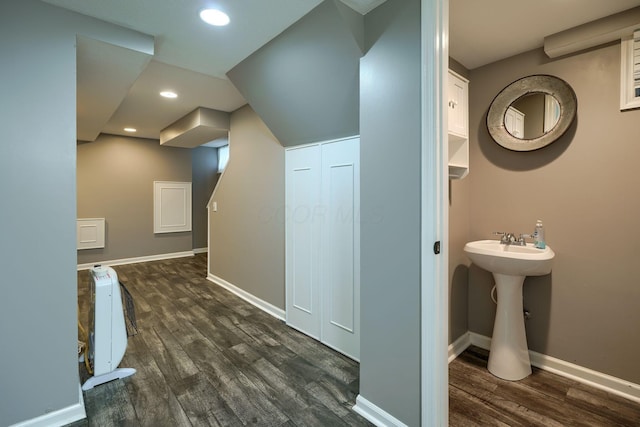 bathroom with a sink, baseboards, recessed lighting, and wood finished floors