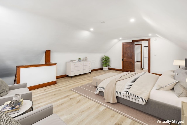 1065-1067 Franklin Ave, Columbus, OH 43205 - bedroom with wood finished floors, vaulted ceiling, baseboards, and recessed lighting