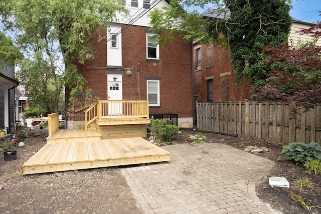 1065-1067 Franklin Ave, Columbus, OH 43205 - back of property featuring brick siding, a patio, and a wooden deck