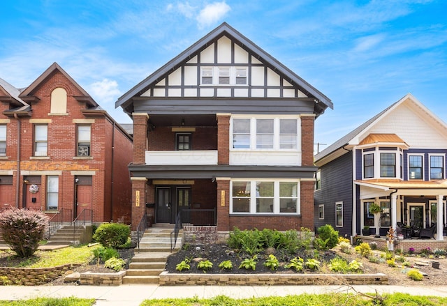 1065-1067 Franklin Ave, Columbus, OH 43205 - view of front facade featuring brick siding and a porch