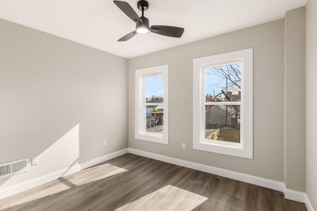 776 S 22nd St Unit 774, Columbus, OH 43206 - unfurnished room with a ceiling fan, baseboards, dark wood finished floors, and visible vents