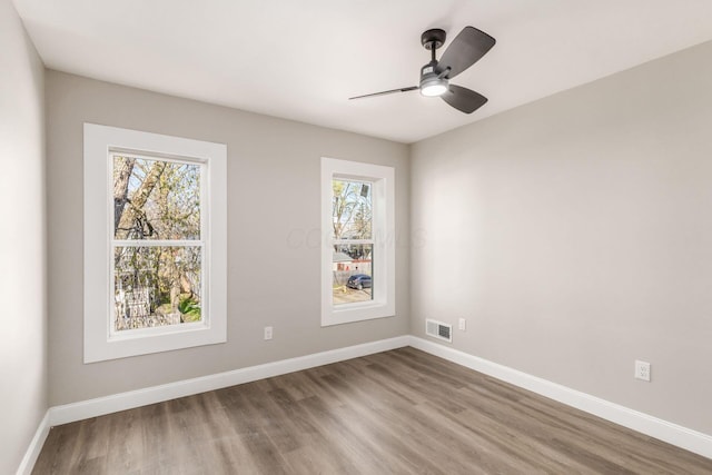776 S 22nd St Unit 774, Columbus, OH 43206 - empty room with ceiling fan, visible vents, baseboards, and wood finished floors