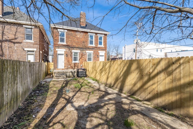 776 S 22nd St Unit 774, Columbus, OH 43206 - rear view of house featuring brick siding, fence private yard, and a chimney