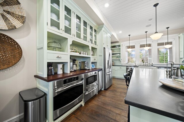 kitchen featuring recessed lighting, open shelves, butcher block counters, white cabinets, and appliances with stainless steel finishes