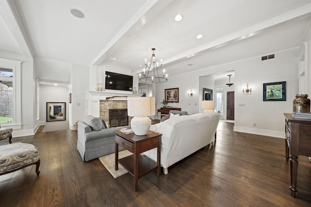 living area featuring visible vents, baseboards, a fireplace, dark wood finished floors, and recessed lighting