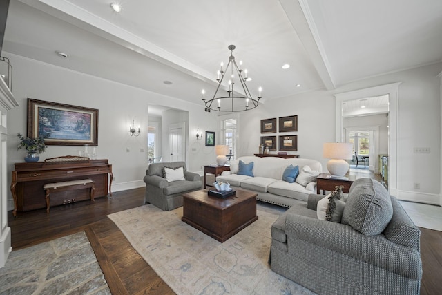 living area with baseboards, a notable chandelier, beamed ceiling, recessed lighting, and wood finished floors