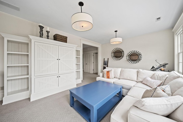 carpeted living area with visible vents
