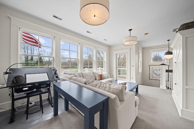 living room featuring carpet flooring and visible vents