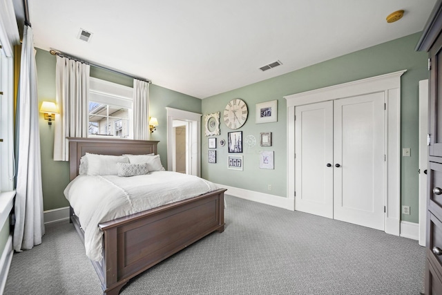 bedroom with visible vents, baseboards, and carpet floors