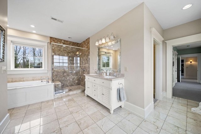 bathroom featuring visible vents, marble finish floor, a stall shower, and plenty of natural light