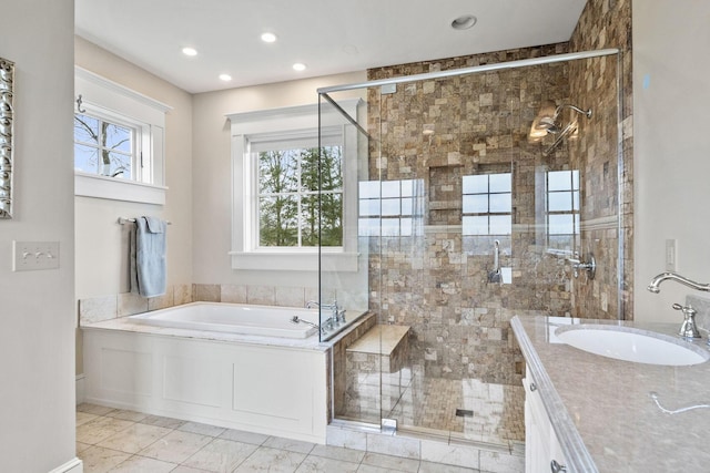 full bath featuring a bath, a shower stall, vanity, and recessed lighting