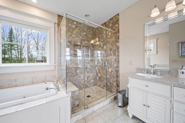 full bath with vanity, a stall shower, and a tub with jets