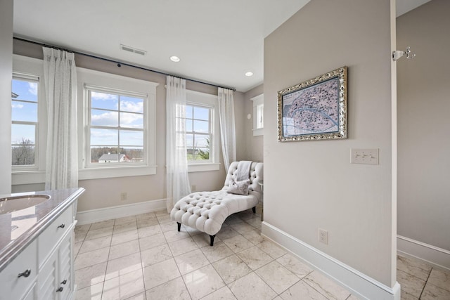 sitting room featuring recessed lighting, visible vents, baseboards, and marble finish floor
