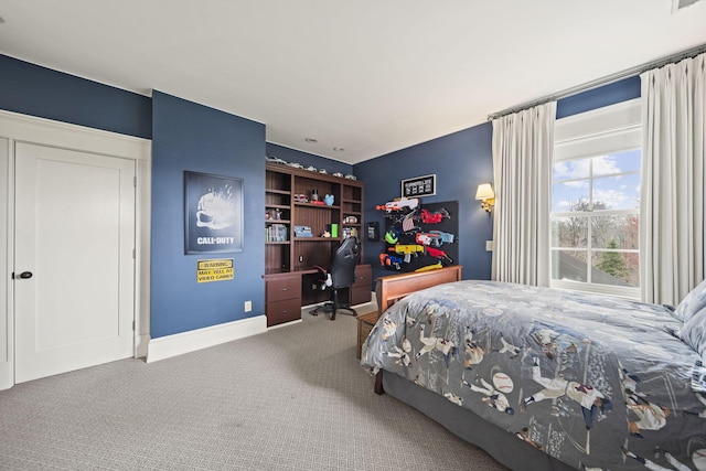 bedroom featuring baseboards and carpet flooring